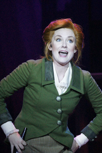 a theater actress in a green jacket